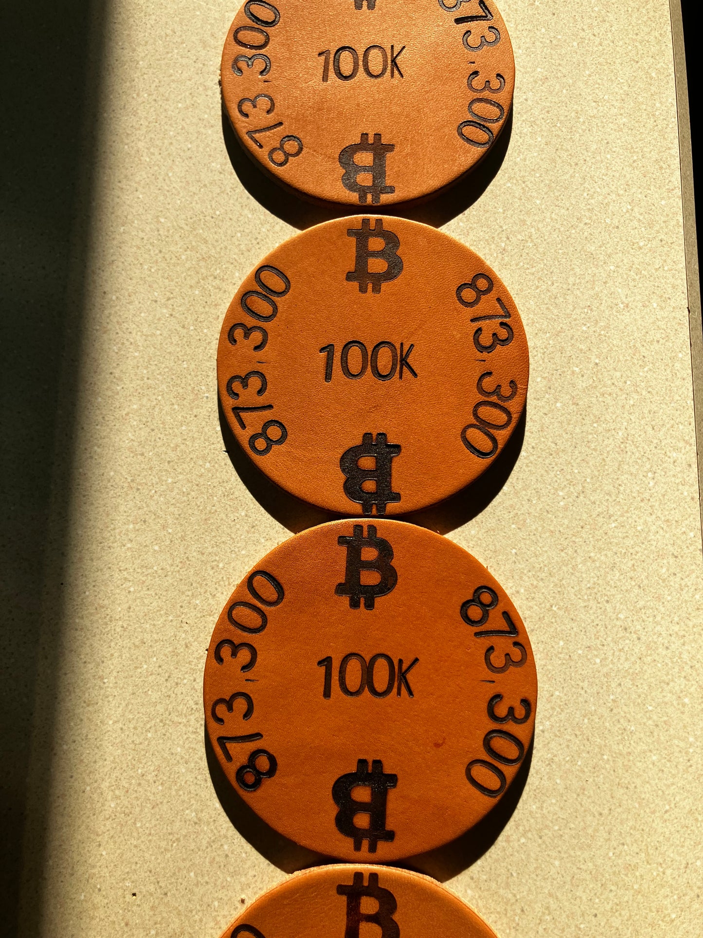 The “100K Edition” Leather Coaster